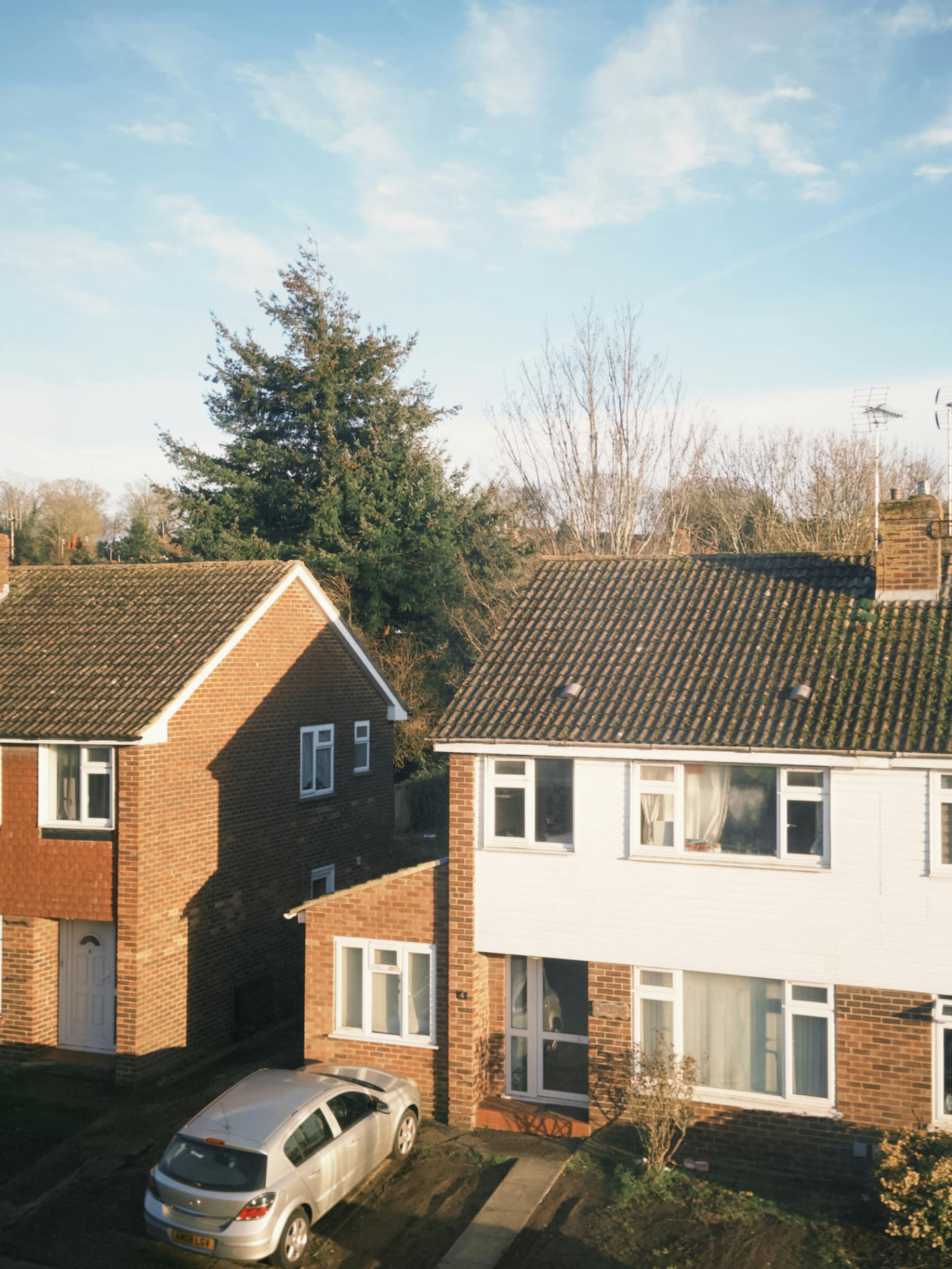 Brick semi-detached houses in morning sunlight